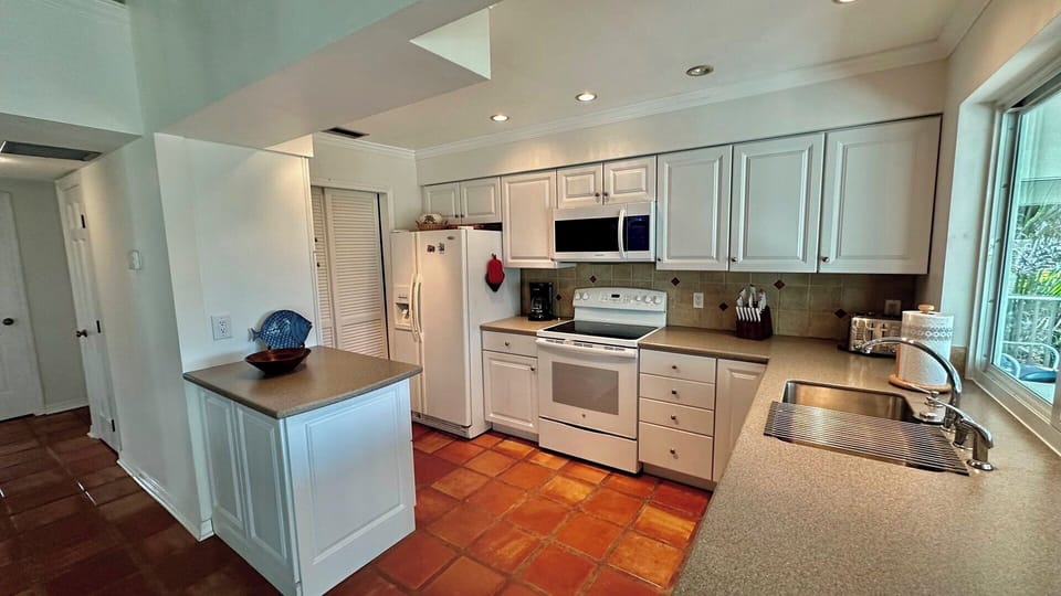 The laundry room is adjacent to the kitchen.