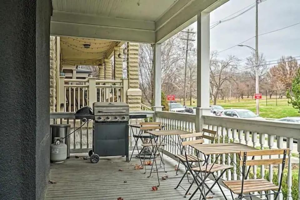 Our patio features two charming wooden table sets with chairs, perfect for al fresco dining, and a griller for your cookout delights—all with a beautiful view of nature.
