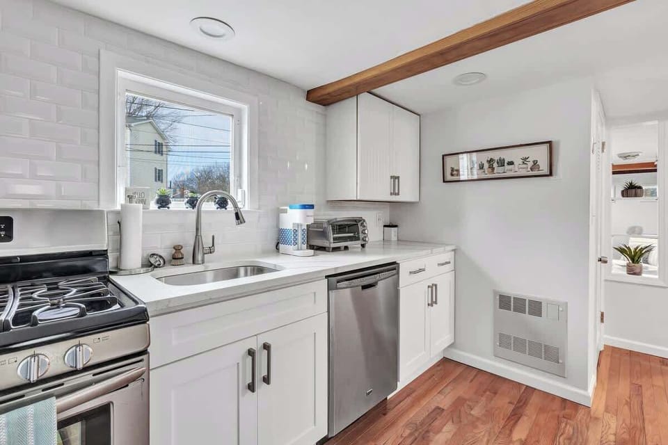 Cottage kitchen - stocked with Keurig, toaster, blender, microwave