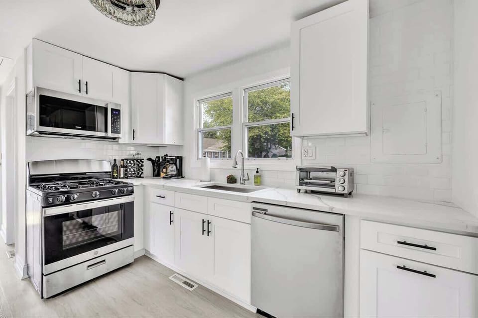 Completely remodeled and fully stocked kitchen, window treatments have been added!