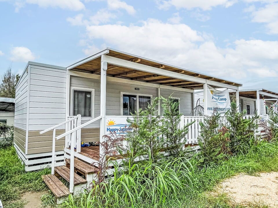 Sky, Cloud, Plant, Ecoregion, Building, Window, Land Lot, Wood, Cottage, Grass