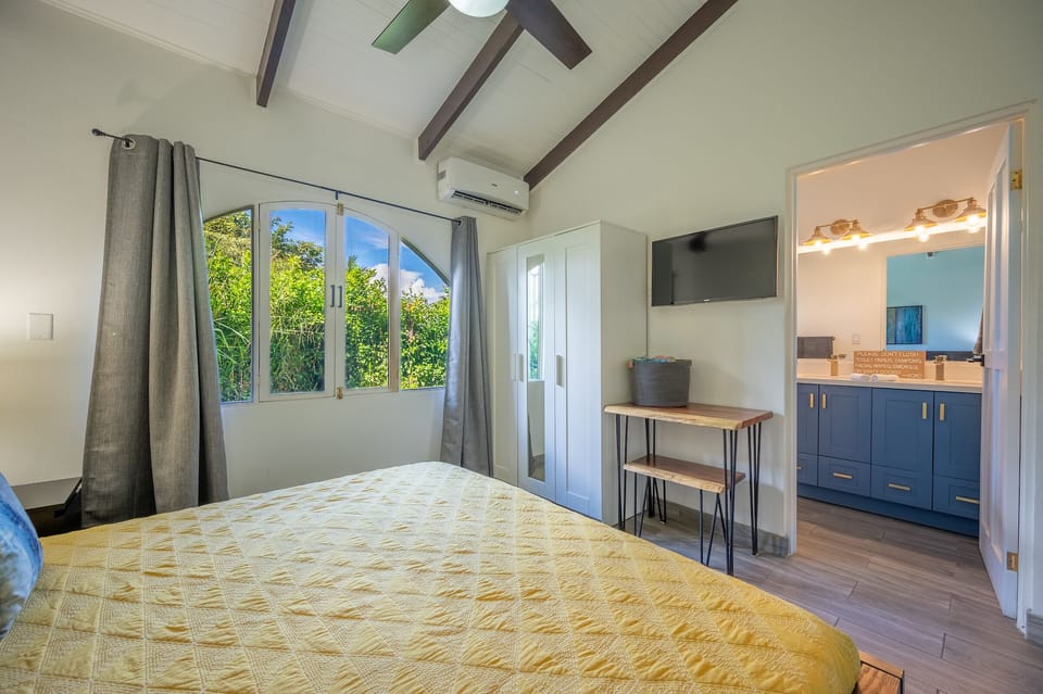 Wake up to a sun-soaked morning in the bedroom, and open the window to feel the fresh, warm breeze!