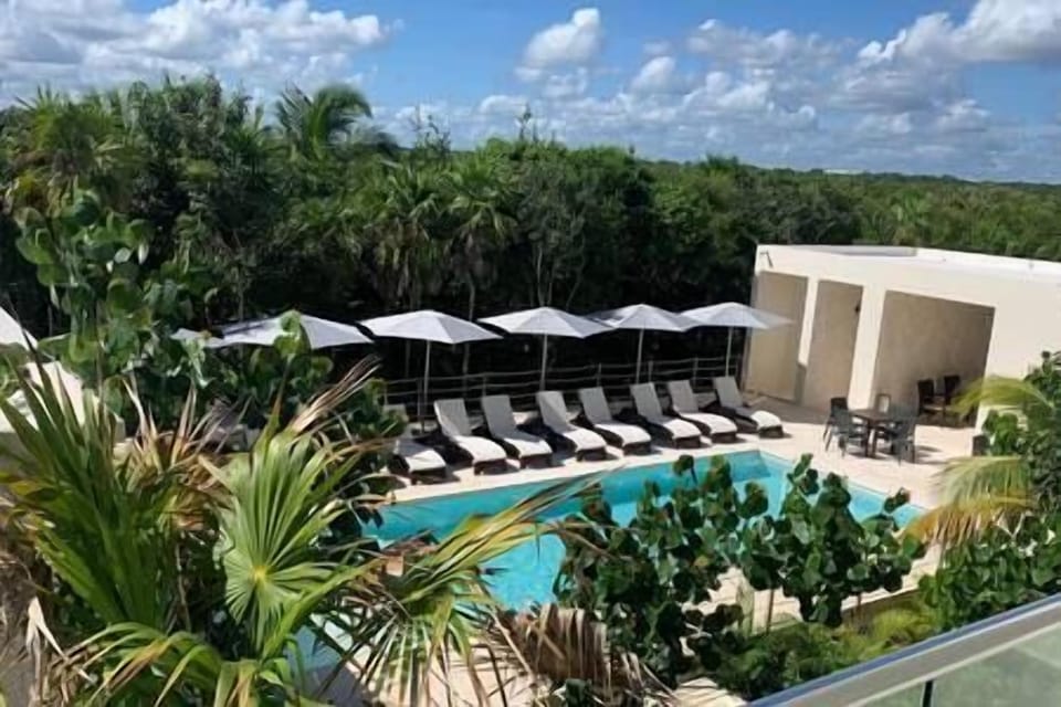 The view from the private balcony of the pool, grill and dining area. 