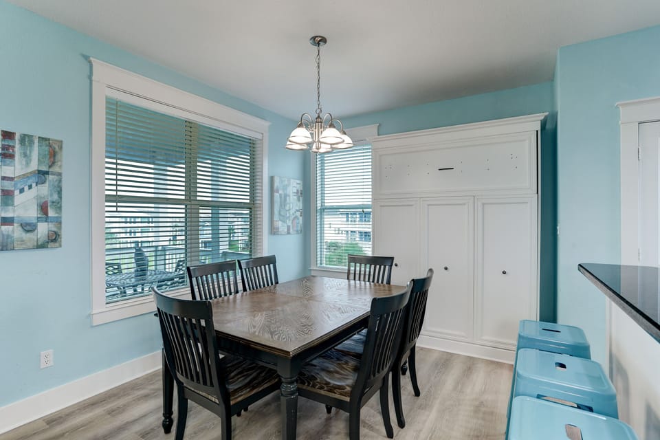 A full dinning room( it has a sleeping bed, raised up by the corner)