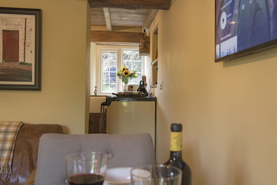 Ground floor: Sitting room leading through to the cottage kitchen