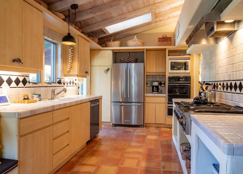Large galley kitchen with gas cooktop