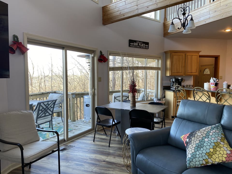 Living room on main floor with convertible dining table.