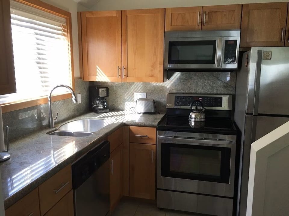 New cupboards, granite counters, stainless steel sink and appliances.