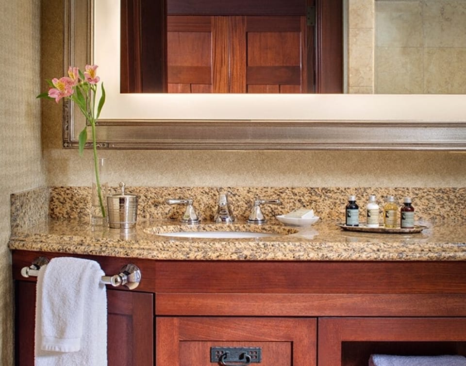 Start your day at a gleaming granite vanity, hotel-fresh.