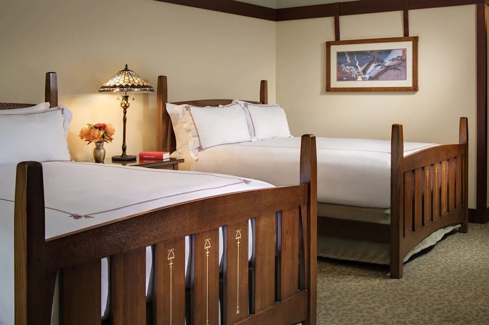 Settle into plush beds under warm wood-and-linen comfort.