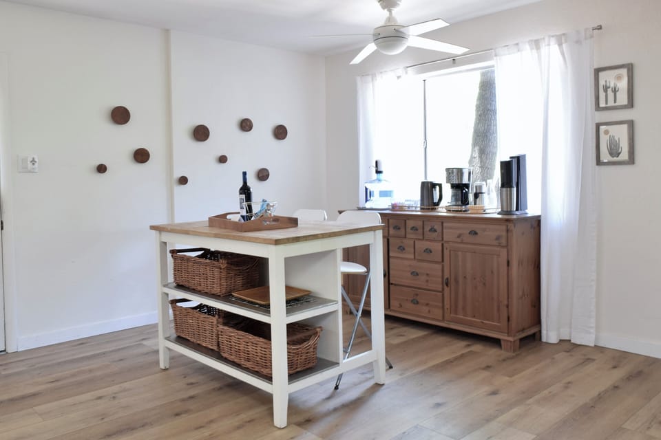 Open kitchen is well stocked with cooking implements and basic ingredients.