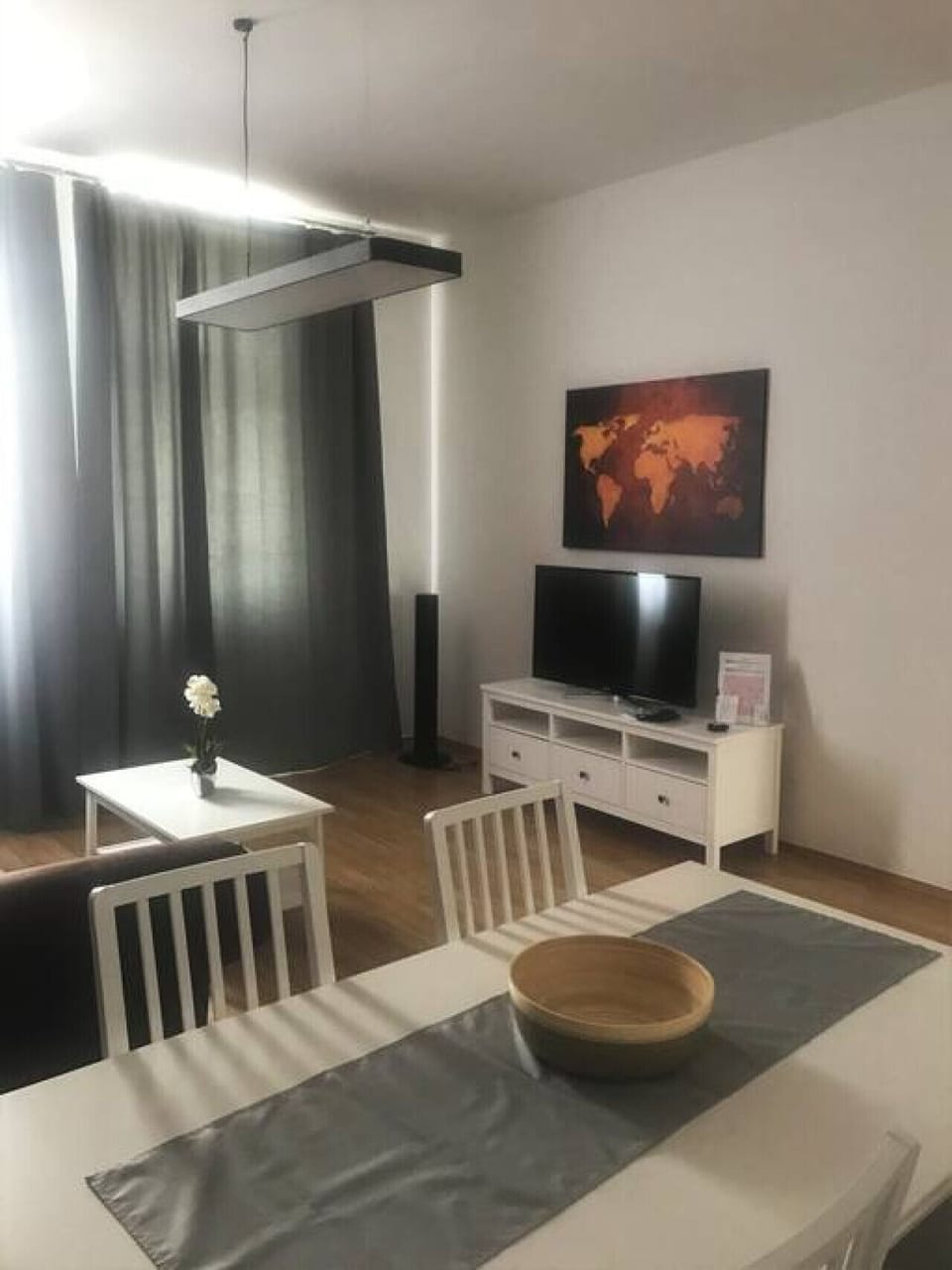 Your living room, a hub of daily activities and conversation, adorned by Arbio Designers, offering comfortable seating and a welcoming ambiance.