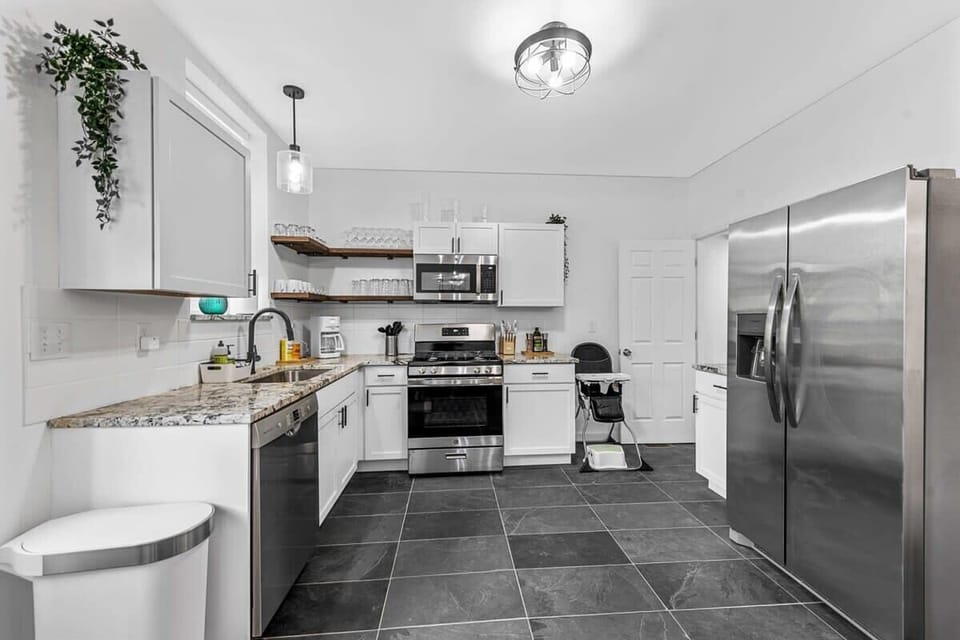 Enter the functional kitchen! You'll find granite countertops, plenty of counter space, and cabinets for all your vacation goodies.