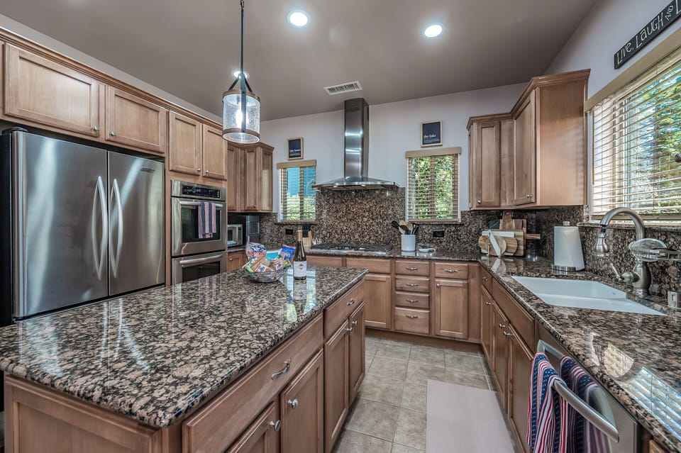 The kitchen is open to the dining area. It is a great space to visit while preparing meals. Basic cooking oils and spices included!