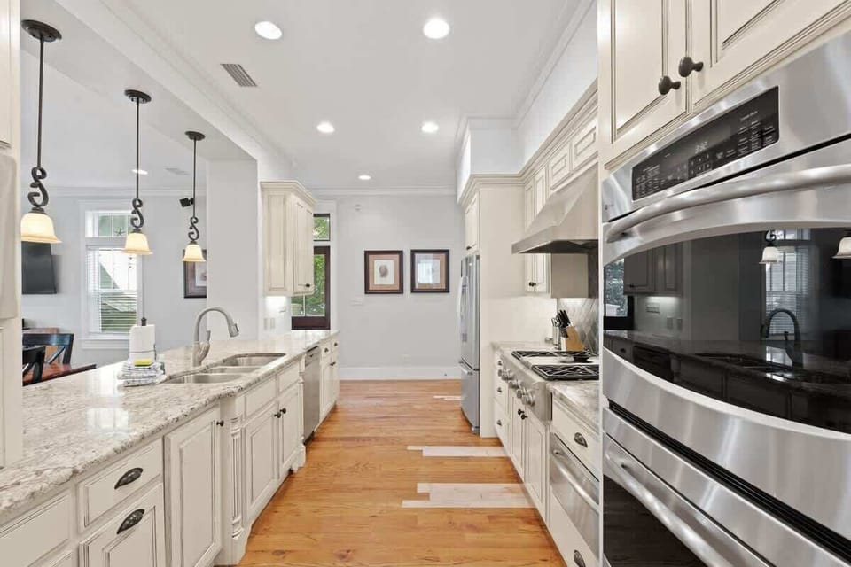 - Perfect blend of functionality & style in this gorgeous kitchen with granite countertops - Essential appliances, including a double oven, make cooking & entertaining effortless - Open & inviting, this space is ideal for family gatherings or casual