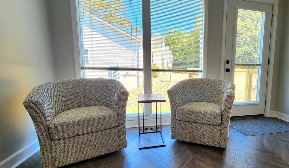 Sitting area in bedroom.  Rooms separated by sliding barn-door.