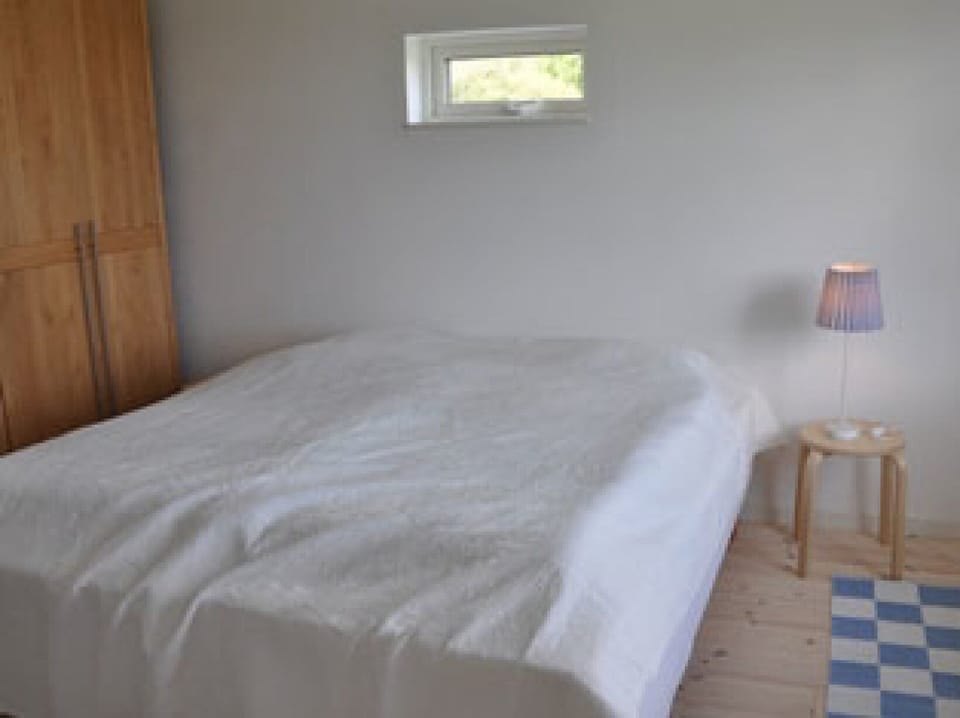 Master bedroom with enough space for a baby crib or an extra bed if needed.