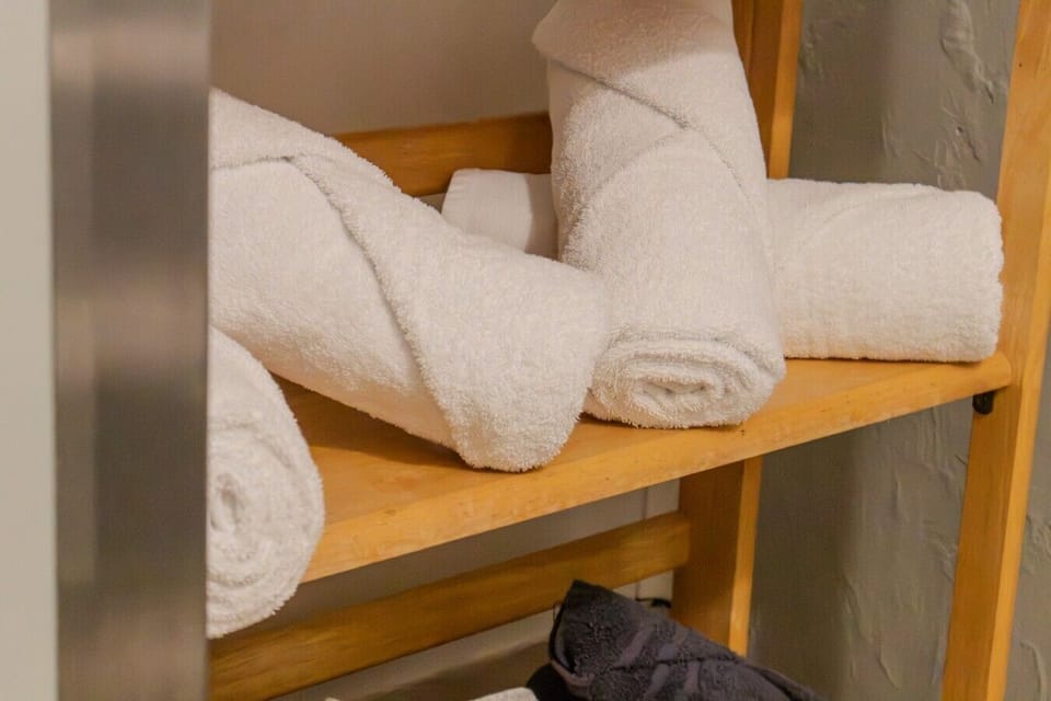 California Design Den towels — always rolled, never folded.