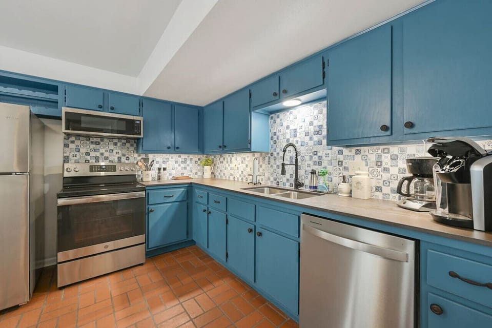 A full kitchen with stainless steel appliances