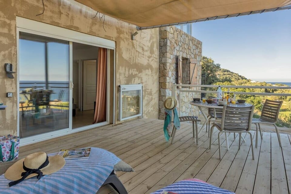 Terrace furnished with garden furniture and dining table