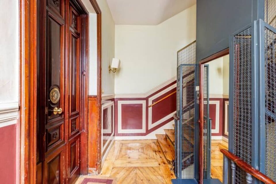 The entrance to the apartment on the second floor. The lift on the right.