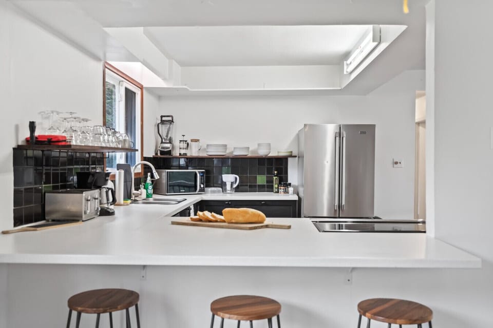 Beautiful, fully equipped kitchen with all major appliances—stove, oven, fridge, dishwasher, and more—plus a lovely view of the backyard!