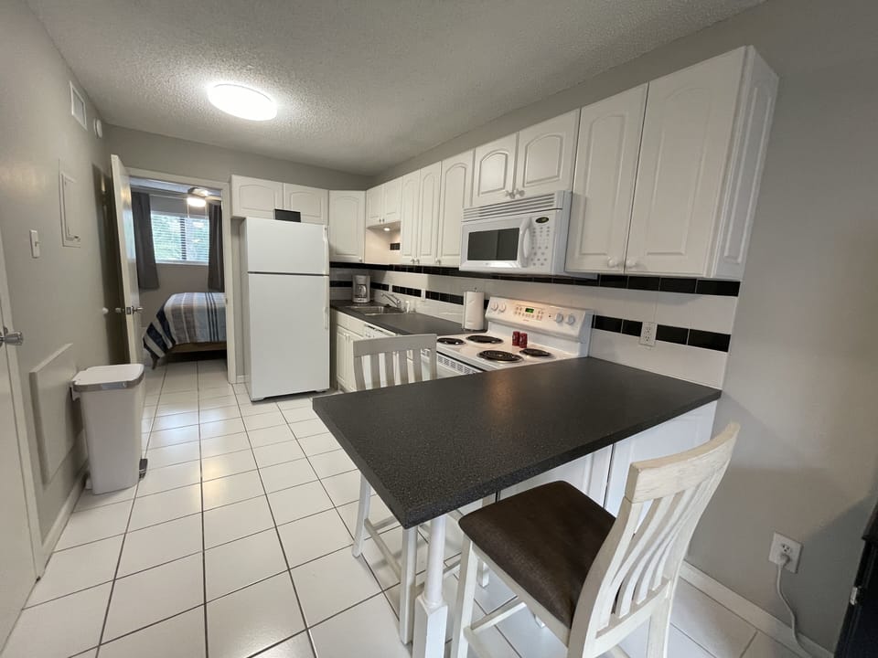 Full size fully equipped kitchen with a Keurig and  a traditional coffee maker. 