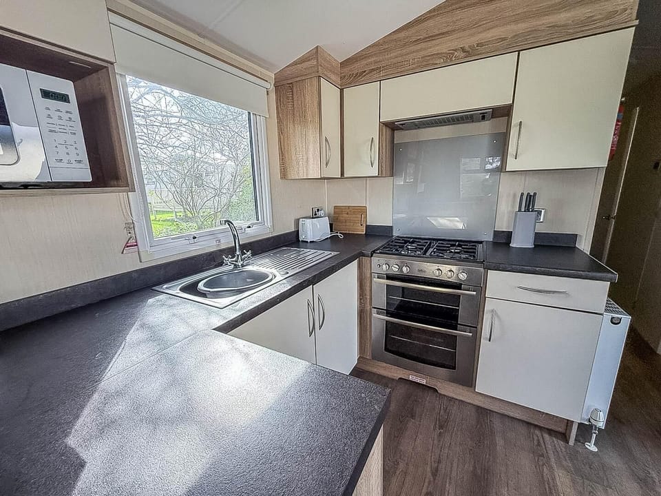 Book your last minute caravan holidays at Park Holidays UK Broadland Sands and enjoy the comfort of a welcoming kitchen area in a caravan, perfect for a relaxing getaway near Suffolk beaches.