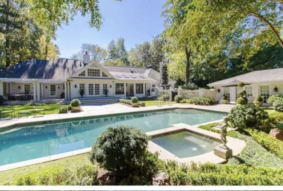 Back of house with pool & hot tub