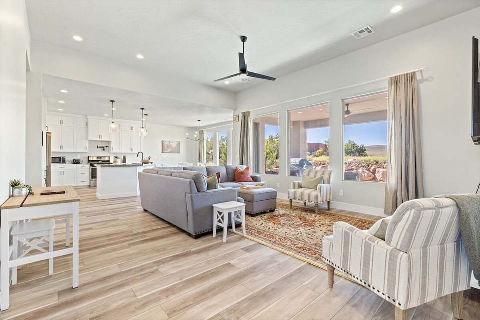With traditional furnishings and large windows that frame serene outdoor views, it's a perfect blend of comfort and style for relaxing or entertaining.