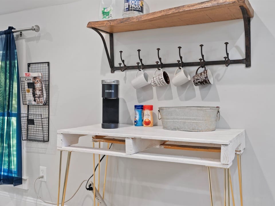 Coffee area stocked with coffee pods & teas with filtered water jugs
