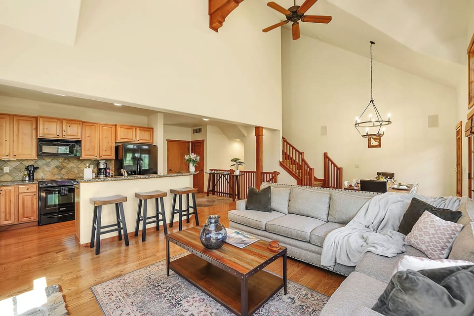 Enjoy the seamless flow between the fully-equipped kitchen and dining area, where the spacious table comfortably seats six for memorable meals with family and friends