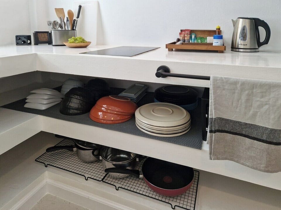Fully equipped kitchen with everything you need for a comfortable stay, including a variety of cookware, dishes, and utensils. Enjoy the convenience of modern appliances and a well-organized space for easy meal preparation.