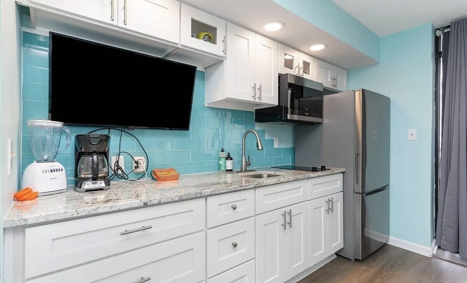 Kitchen Amenities include Full Size Fridge, 2-Burner Stove, Microwave, Coffee Pot, Blender and Kitchen Pots/Pans, Dishes and Silverware
