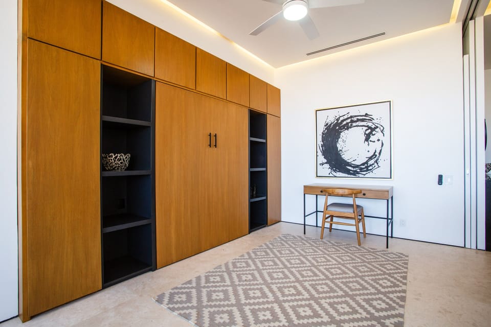 The queen-size murphy bed effortlessly folds away to optimize space during the day
