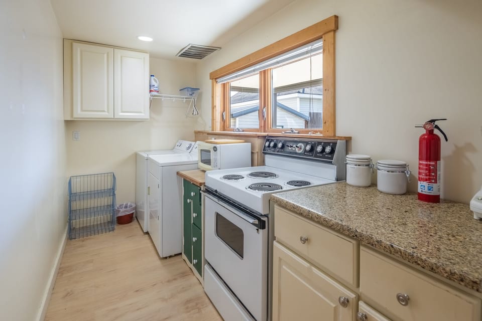 Granite counter, full size Stove/Oven.  Cooking utensils.