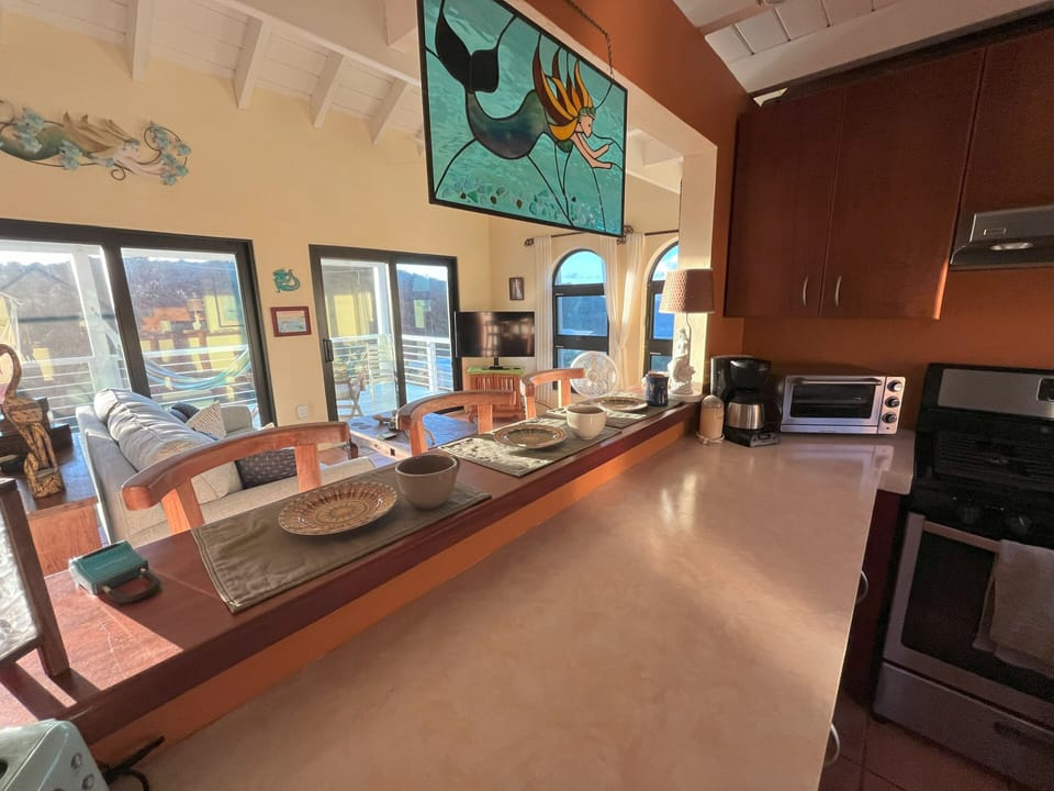 The pass-through window from the kitchen allows the cook to enjoy the view!