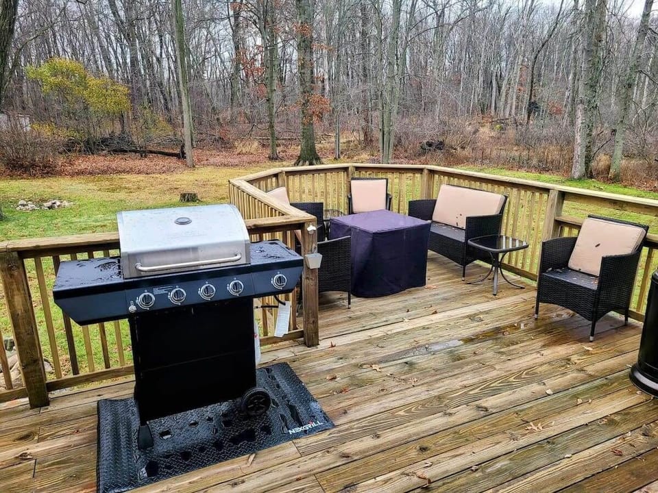 Backyard grill and relaxing deck area