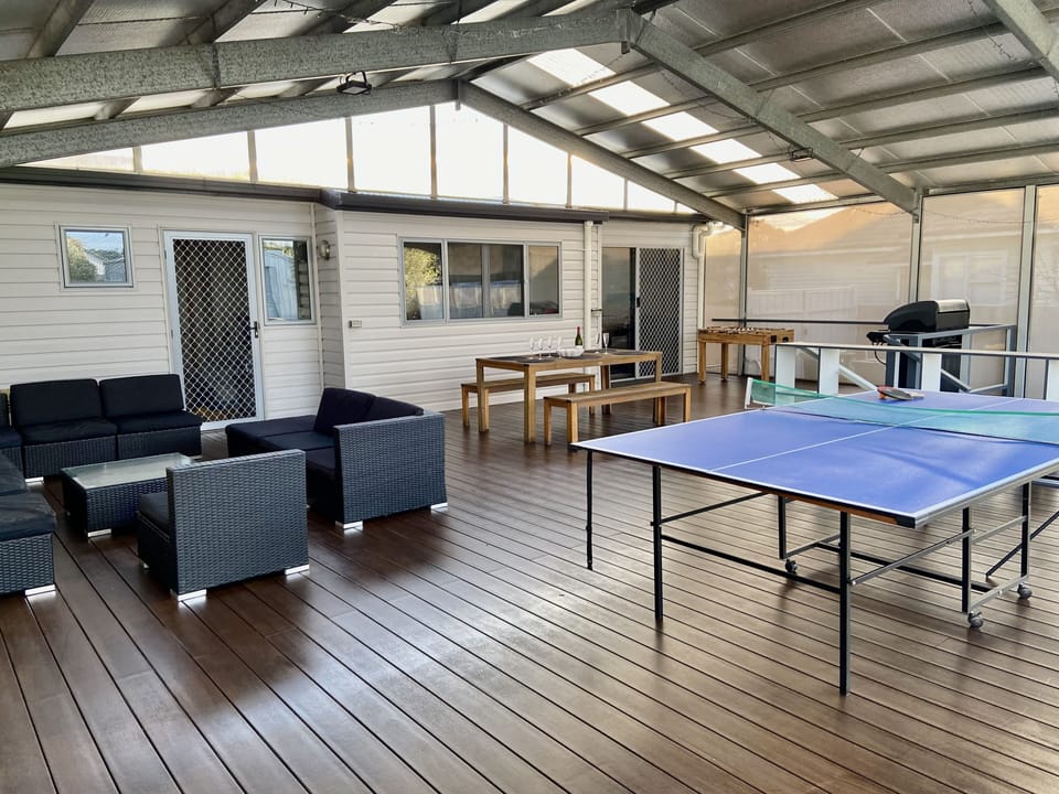 Outdoor lounge, table tennis, dining and air hockey