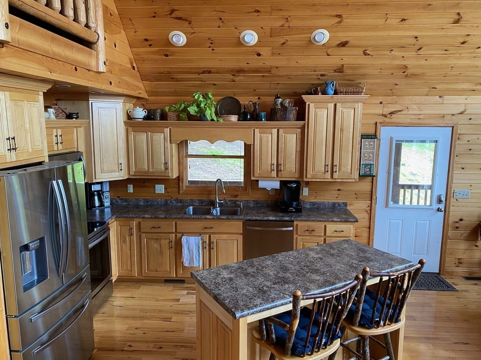 Fully stocked kitchen with all appliances.