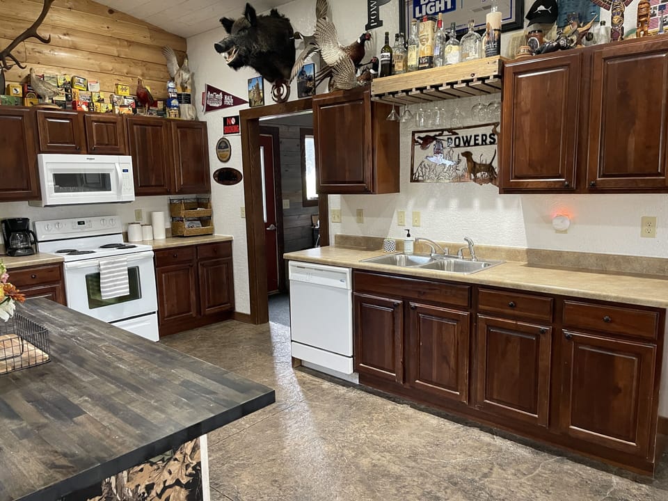 Full kitchen, plenty of cookware, dishes and  utensils.