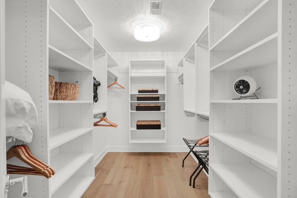 Impeccable style begins here: explore our spacious walk-in closet. #ClosetGoals