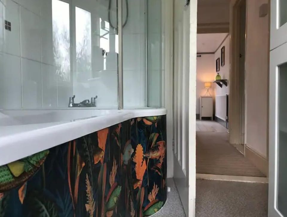 Bathroom is upstairs, with stylish bespoke bath/tub