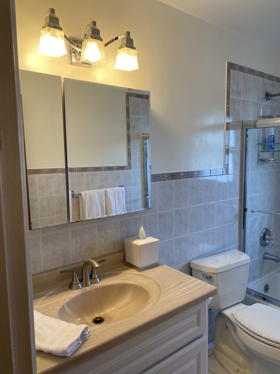 Large clean bathroom with a combo tub and shower
