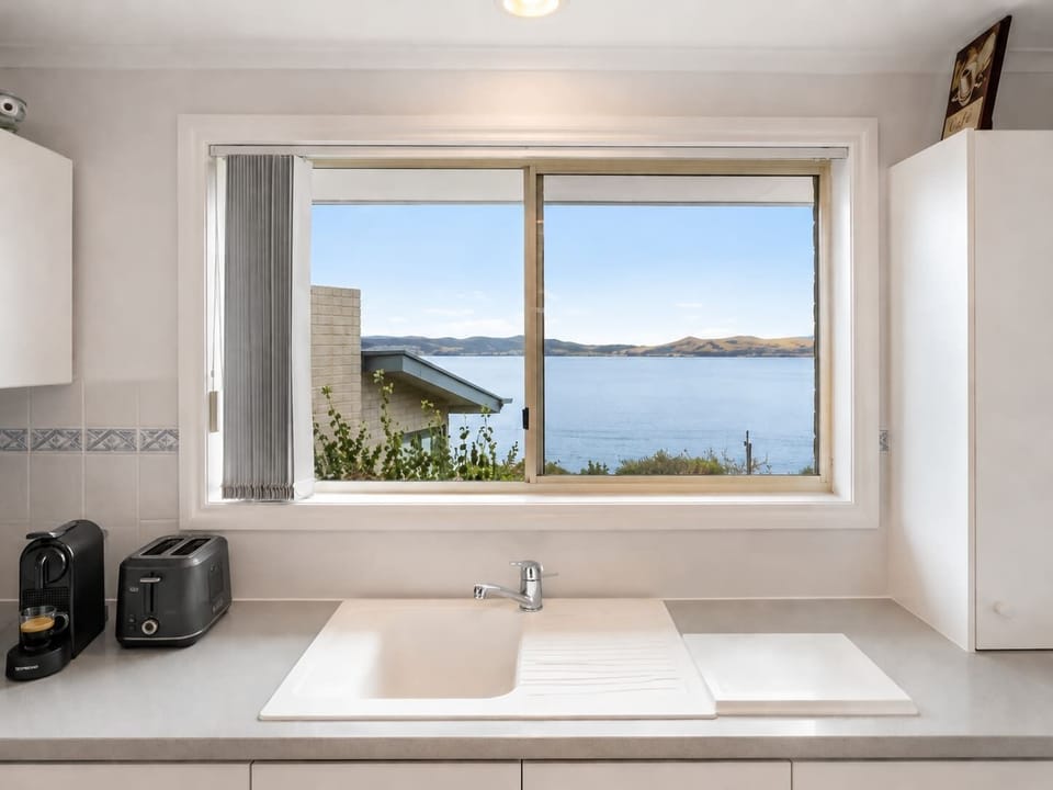 Cook with a view! The bright kitchen overlooks the River Derwent and is fully stocked for longer stays.
