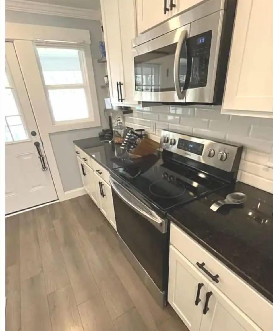 A newly renovated kitchen with sleek appliances.