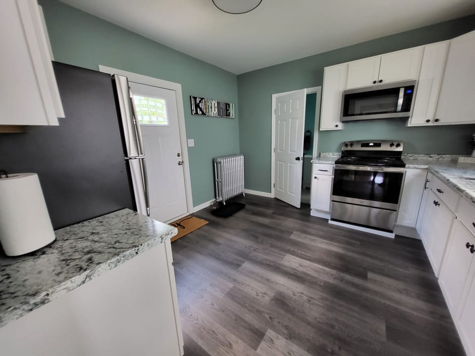 Newly updated kitchen.  Stove, microwave, dishwasher, pots/pans provided. 