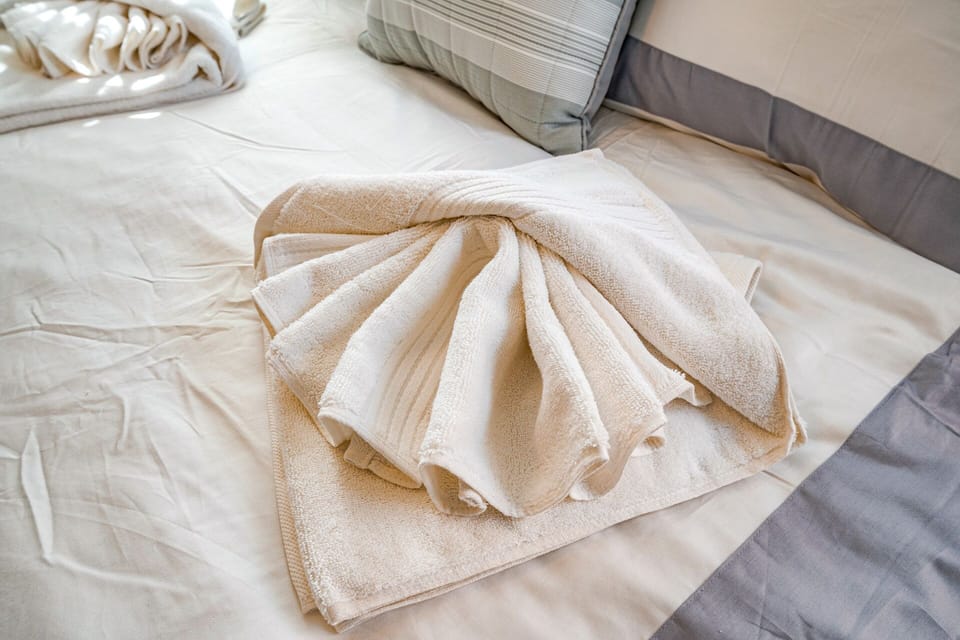 Thoughtful Towel Display on Fresh Linens