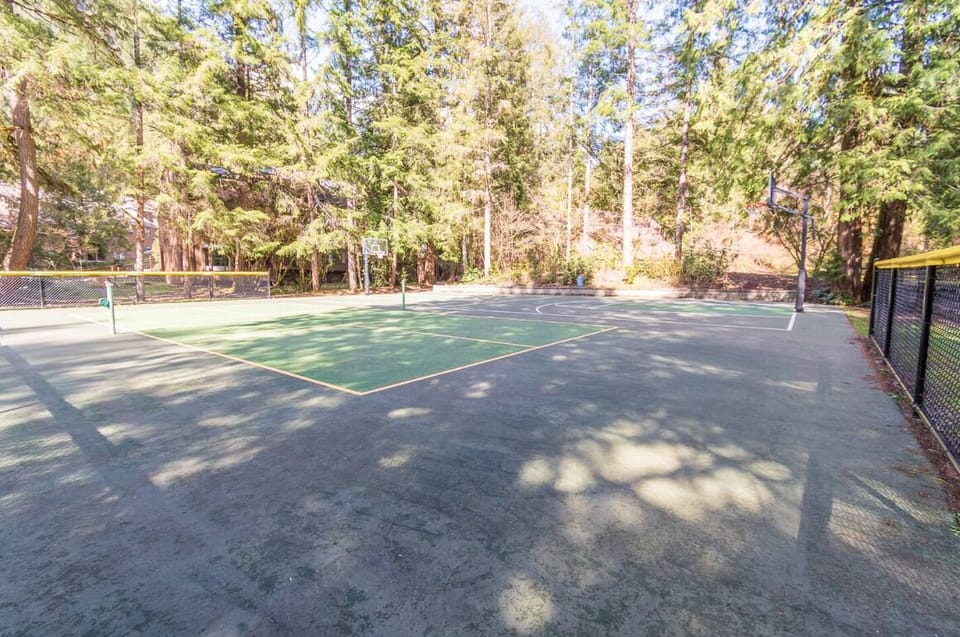 Outdoor tennis court within Snowater Resort.
