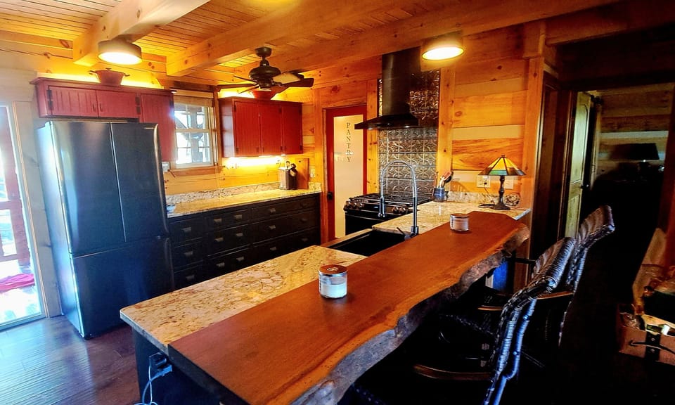 Custom crafted! Sit at teak live edge bar and table while someone else cooks :)